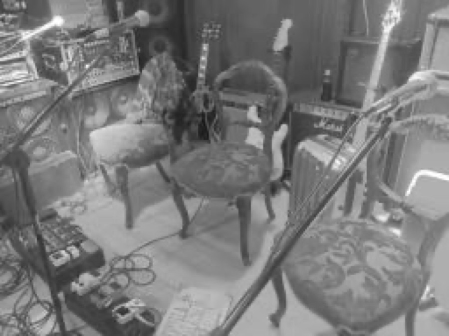 Velvet chairs and mics in a rehearsal room